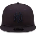 cappellino-snapback-blu-navy-con-visiera-piatta-e-logo-blu-navy-9fifty-league-essential-dei-new-york-yankees-mlb-di-new-era