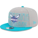 cappello-piatto-grigio-e-blu-snapback-9fifty-draft-edition-2023-dei-charlotte-hornets-nba-di-new-era