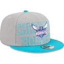 cappello-piatto-grigio-e-blu-snapback-9fifty-draft-edition-2023-dei-charlotte-hornets-nba-di-new-era
