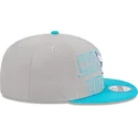 cappello-piatto-grigio-e-blu-snapback-9fifty-draft-edition-2023-dei-charlotte-hornets-nba-di-new-era