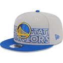 cappellino-piatto-grigio-e-blu-snapback-9fifty-draft-edition-2023-dei-golden-state-warriors-nba-di-new-era