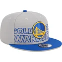 cappellino-piatto-grigio-e-blu-snapback-9fifty-draft-edition-2023-dei-golden-state-warriors-nba-di-new-era