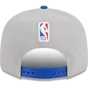 cappellino-piatto-grigio-e-blu-snapback-9fifty-draft-edition-2023-dei-golden-state-warriors-nba-di-new-era