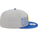 cappellino-piatto-grigio-e-blu-snapback-9fifty-draft-edition-2023-dei-golden-state-warriors-nba-di-new-era