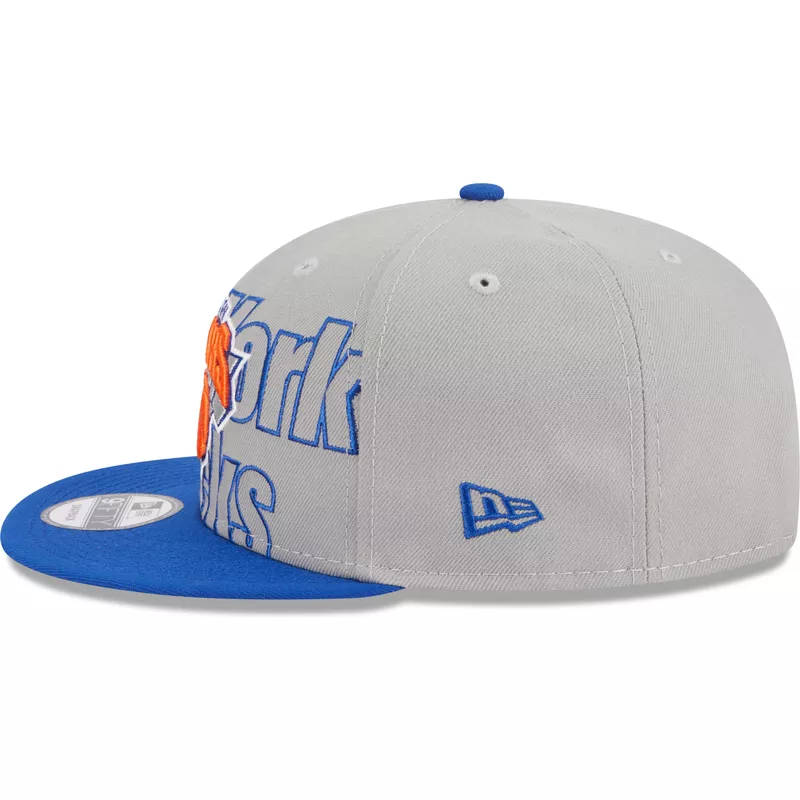 new-era-flat-brim-9fifty-draft-edition-2023-new-york-knicks-nba-grey-and-blue-snapback-cap