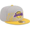 cappellino-piatto-grigio-e-giallo-snapback-9fifty-draft-edition-2023-dei-los-angeles-lakers-nba-di-new-era