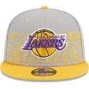 cappellino-piatto-grigio-e-giallo-snapback-9fifty-draft-edition-2023-dei-los-angeles-lakers-nba-di-new-era