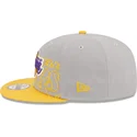 cappellino-piatto-grigio-e-giallo-snapback-9fifty-draft-edition-2023-dei-los-angeles-lakers-nba-di-new-era