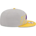 cappellino-piatto-grigio-e-giallo-snapback-9fifty-draft-edition-2023-dei-los-angeles-lakers-nba-di-new-era