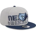 cappellino-piatto-grigio-e-blu-navy-snapback-9fifty-draft-edition-2023-dei-memphis-grizzlies-nba-di-new-era