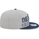 cappellino-piatto-grigio-e-blu-navy-snapback-9fifty-draft-edition-2023-dei-memphis-grizzlies-nba-di-new-era