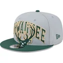 cappellino-piatto-grigio-e-verde-snapback-9fifty-tip-off-2023-dei-milwaukee-bucks-nba-di-new-era