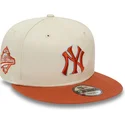 cappello-piatto-beige-e-marrone-snapback-9fifty-patch-dei-new-york-yankees-mlb-di-new-era