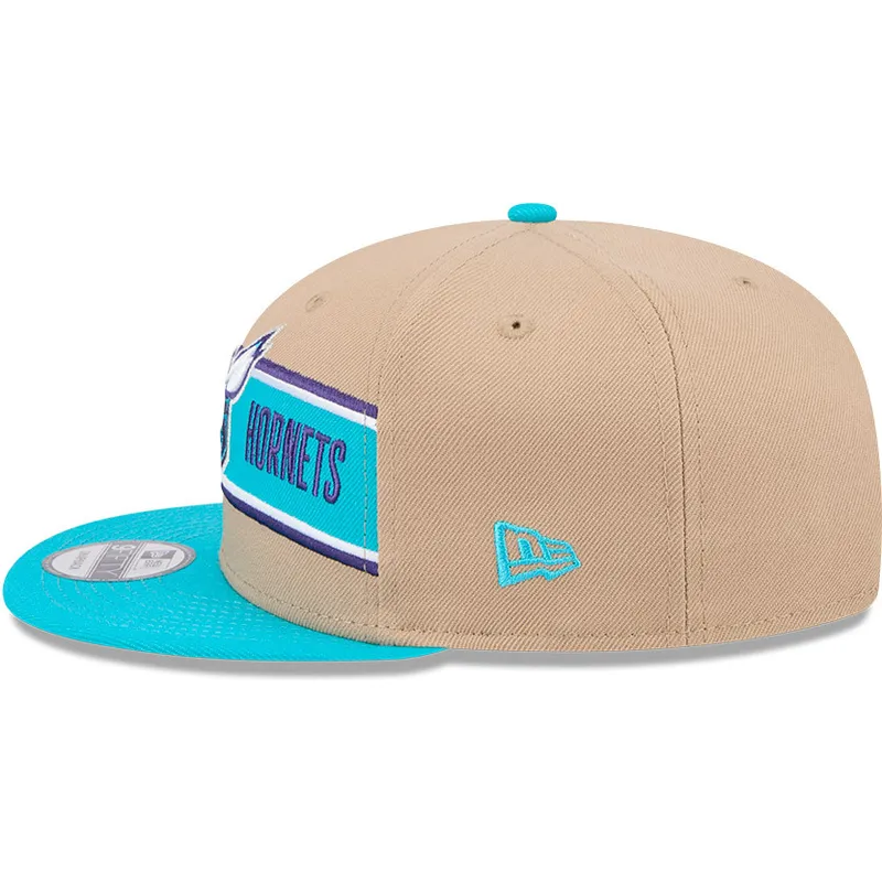 cappello-piatto-marrone-e-blu-snapback-9fifty-draft-2024-di-charlotte-hornets-nba-di-new-era