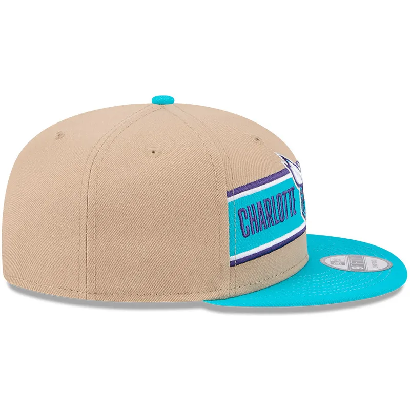 cappello-piatto-marrone-e-blu-snapback-9fifty-draft-2024-di-charlotte-hornets-nba-di-new-era