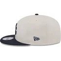 cappello-piatto-beige-e-blu-navy-snapback-9fifty-4th-of-july-degli-atlanta-braves-mlb-di-new-era