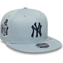 cappello-piatto-blu-snapback-con-logo-blu-navy-9fifty-original-fit-world-series-dei-new-york-yankees-mlb-di-new-era