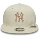 cappello-snapback-piatto-beige-con-logo-beige-9fifty-original-fit-world-series-new-york-yankees-mlb-di-new-era