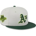 cappello-piatto-beige-e-verde-aderente-59fifty-clr-dvlp-di-oakland-athletics-mlb-di-new-era