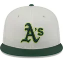 cappello-piatto-beige-e-verde-aderente-59fifty-clr-dvlp-di-oakland-athletics-mlb-di-new-era