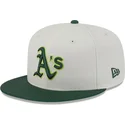 cappello-piatto-beige-e-verde-aderente-59fifty-clr-dvlp-di-oakland-athletics-mlb-di-new-era