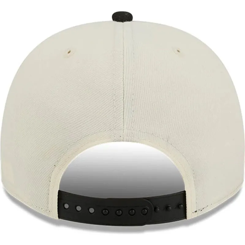 gorra-curva-beige-y-negra-snapback-9fifty-a-frame-precurved-hardwood-classics-de-toronto-raptors-nba-de-new-era